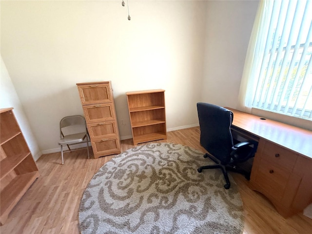 11204 Clear Oak Cir, New Port Richey, FL 34654 - office area with light wood-style flooring and baseboards