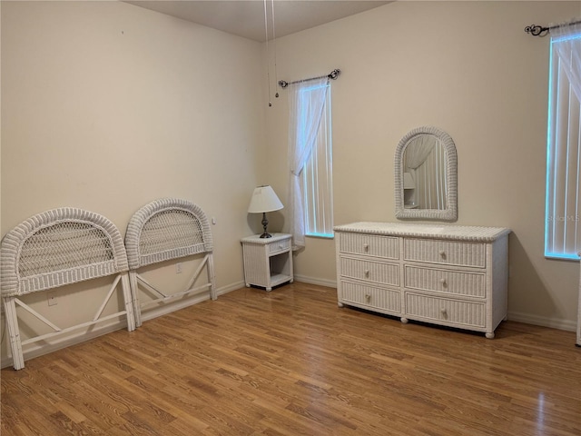 11204 Clear Oak Cir, New Port Richey, FL 34654 - bedroom with wood finished floors and baseboards