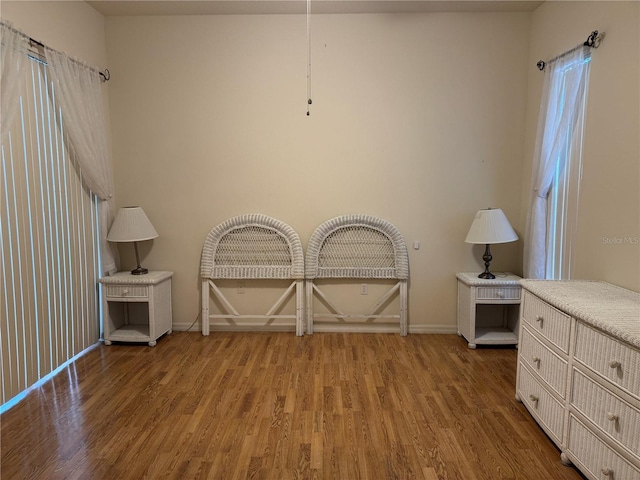11204 Clear Oak Cir, New Port Richey, FL 34654 - empty room with wood finished floors and baseboards
