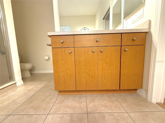 11204 Clear Oak Cir, New Port Richey, FL 34654 - bathroom with vanity, tile patterned floors, toilet, and a stall shower