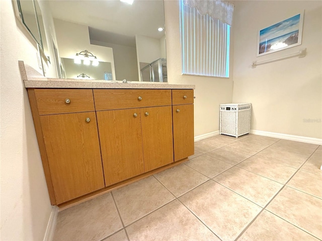 11204 Clear Oak Cir, New Port Richey, FL 34654 - full bathroom featuring vanity, baseboards, tile patterned floors, and an enclosed shower