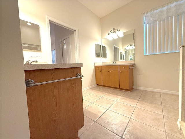 11204 Clear Oak Cir, New Port Richey, FL 34654 - bathroom with tile patterned floors, vanity, and baseboards