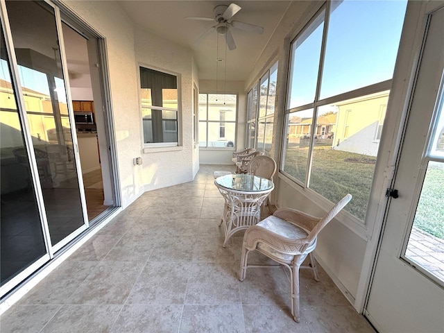 11204 Clear Oak Cir, New Port Richey, FL 34654 - sunroom featuring a ceiling fan and plenty of natural light