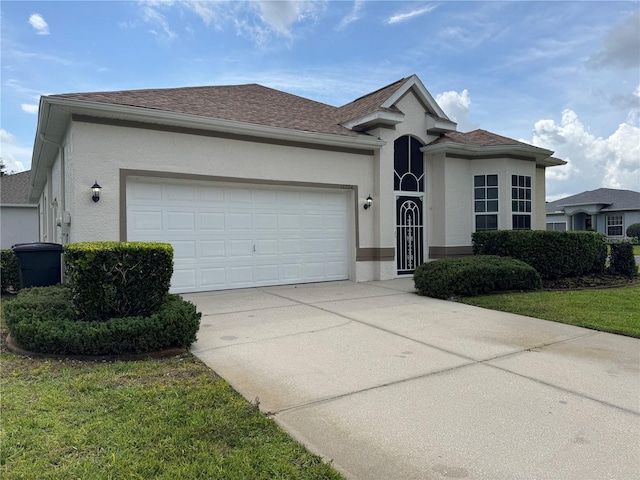 11204 Clear Oak Cir, New Port Richey, FL 34654 - ranch-style home featuring stucco siding, a garage, driveway, and a shingled roof