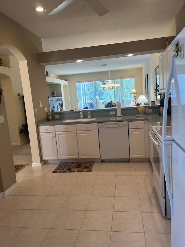 kitchen featuring white cabinetry, white appliances, ceiling fan, and light tile patterned flooring