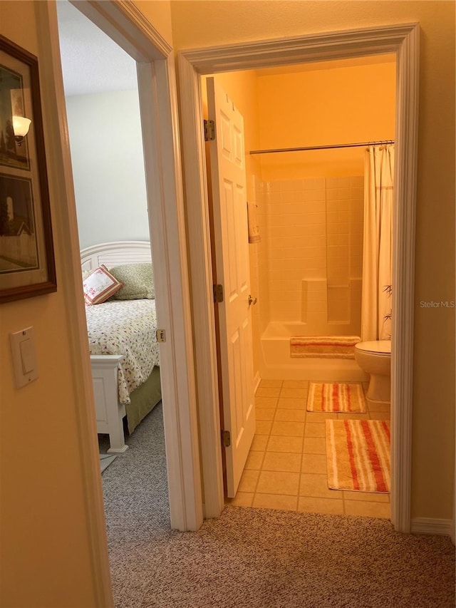 hall with light tile patterned floors