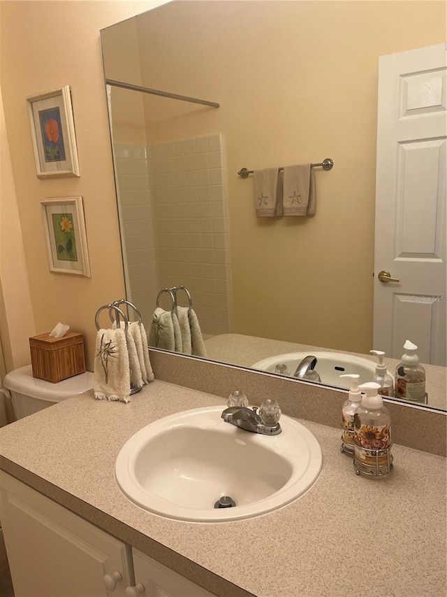 bathroom featuring vanity and a shower