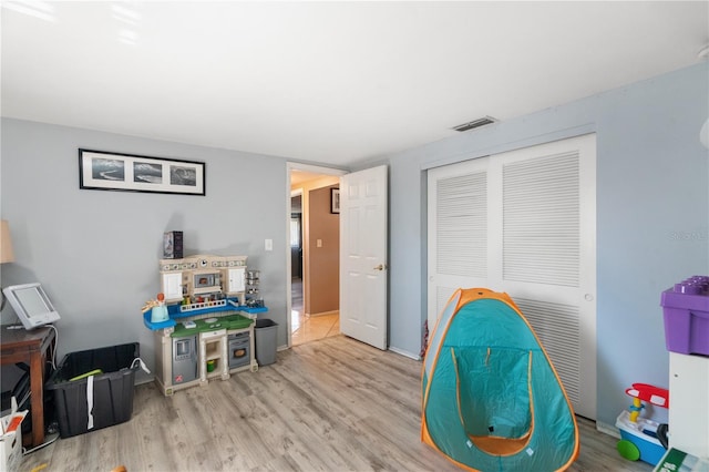 recreation room featuring light hardwood / wood-style floors