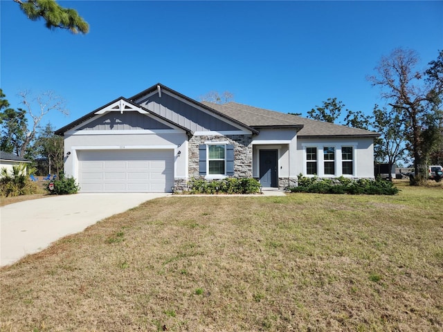 view of front of home featuring a garage and a front lawn