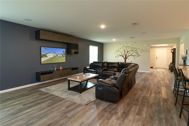 11134 Horned Owl Rd, Weeki Wachee, FL 34614 - living room featuring recessed lighting, wood finished floors, visible vents, and baseboards