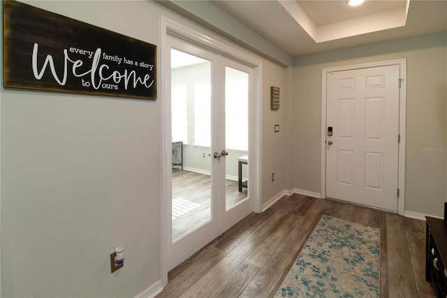 11134 Horned Owl Rd, Weeki Wachee, FL 34614 - doorway to outside with baseboards, french doors, wood finished floors, and a raised ceiling