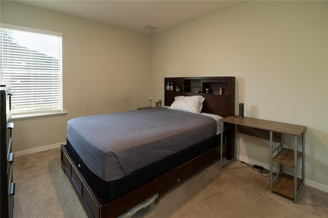 11134 Horned Owl Rd, Weeki Wachee, FL 34614 - carpeted bedroom featuring visible vents, baseboards, and multiple windows