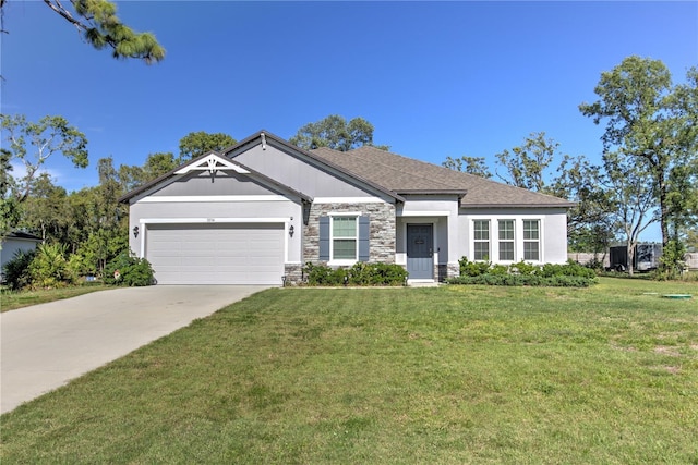 11134 Horned Owl Rd, Weeki Wachee, FL 34614 - view of front of home featuring driveway, stone siding, roof with shingles, a front yard, and a garage