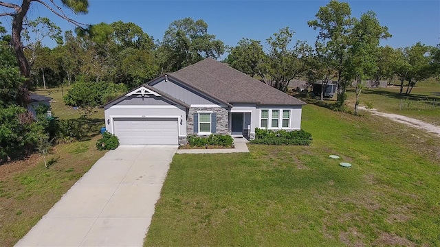 11134 Horned Owl Rd, Weeki Wachee, FL 34614 - view of front facade with a shingled roof, a front lawn, an attached garage, driveway, and stone siding
