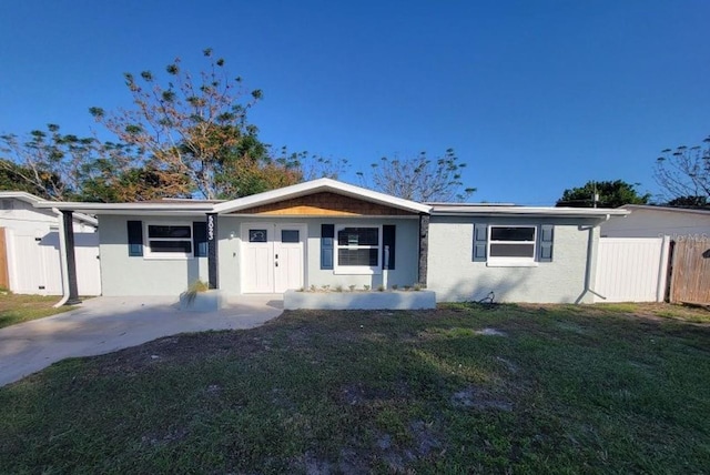 ranch-style home with a front lawn