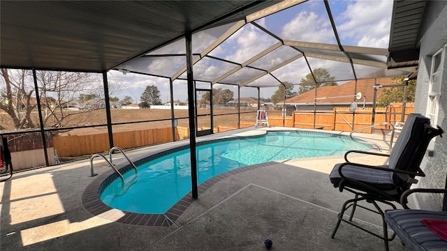 outdoor pool with a lanai, a fenced backyard, and a patio