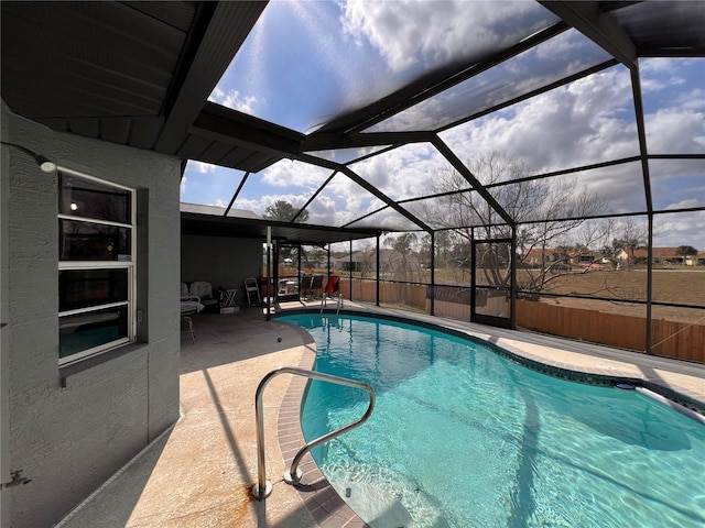 outdoor pool featuring glass enclosure, a patio, and fence