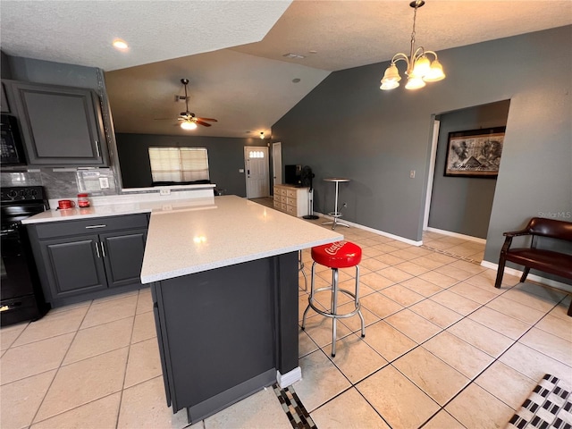 kitchen featuring light tile patterned floors, open floor plan, black range with electric stovetop, and a center island