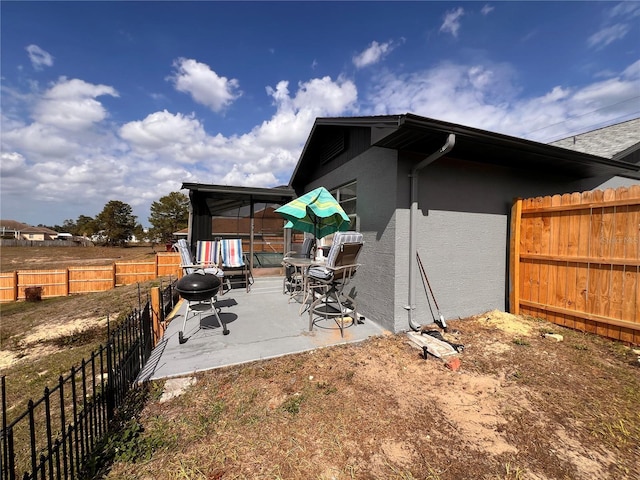 exterior space featuring a patio, a fenced backyard, and stucco siding