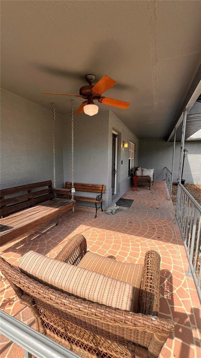 view of patio featuring ceiling fan