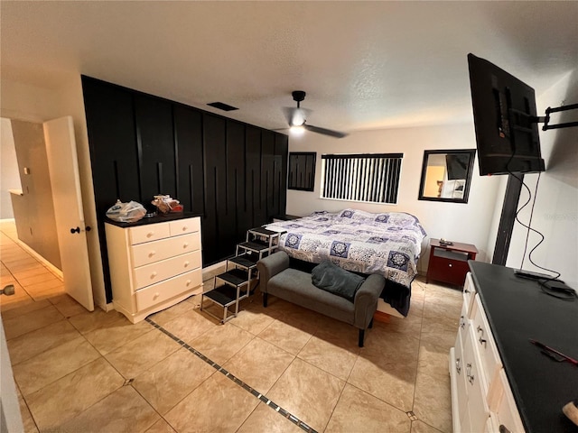 bedroom featuring ceiling fan and light tile patterned floors