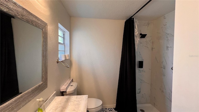 full bath with a textured ceiling, vanity, a marble finish shower, and toilet