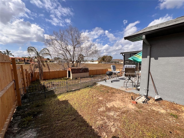 view of yard featuring a patio and a fenced backyard