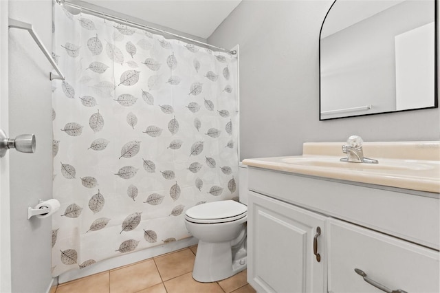 bathroom featuring toilet, tile patterned flooring, a shower with shower curtain, and vanity