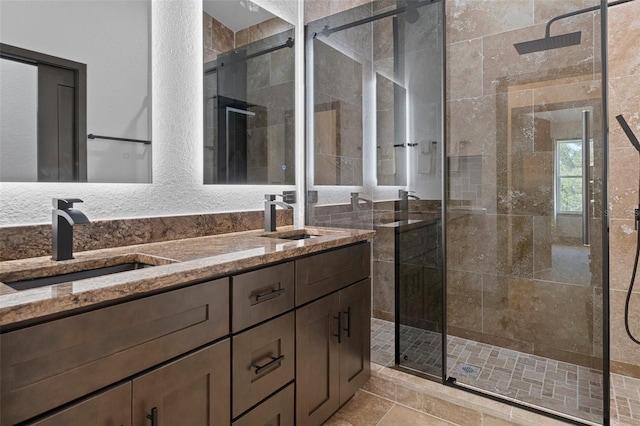 bathroom featuring vanity and an enclosed shower