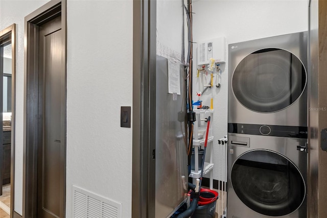 10209 W Waterlander Loop Unit 164, Homosassa, FL 34448 - laundry room featuring stacked washing machine and dryer