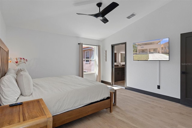 10209 W Waterlander Loop Unit 164, Homosassa, FL 34448 - bedroom with vaulted ceiling, light wood finished floors, ensuite bathroom, and ceiling fan