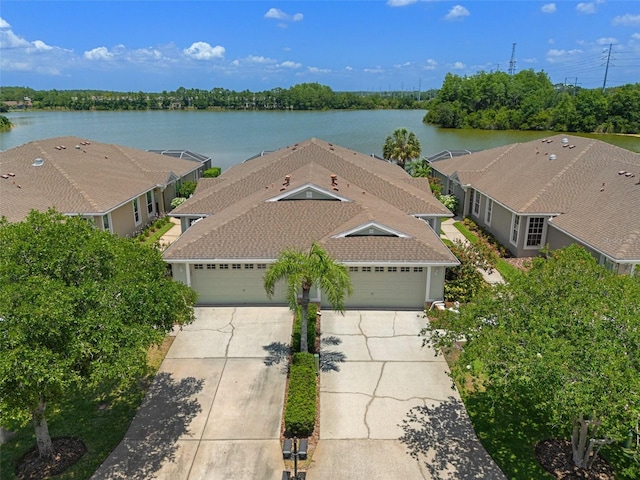 birds eye view of property with a water view