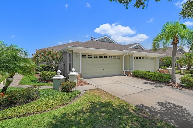 ranch-style home featuring a garage