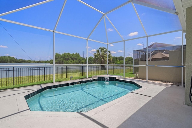 view of pool featuring a patio, a water view, and glass enclosure