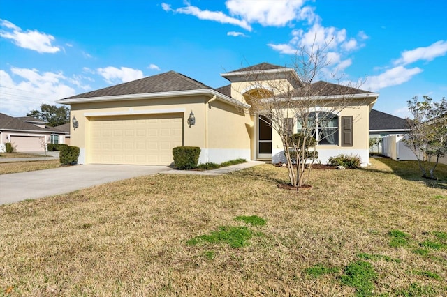 view of front of house featuring a garage and a front lawn