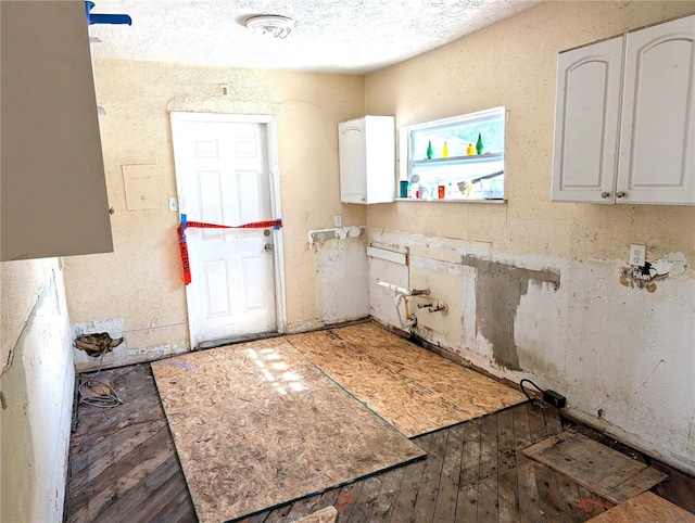 laundry area with dark hardwood / wood-style floors