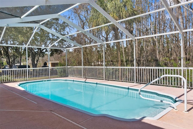 view of pool featuring a lanai and a patio area