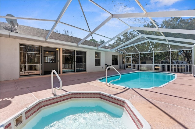 view of pool with a lanai and a patio area