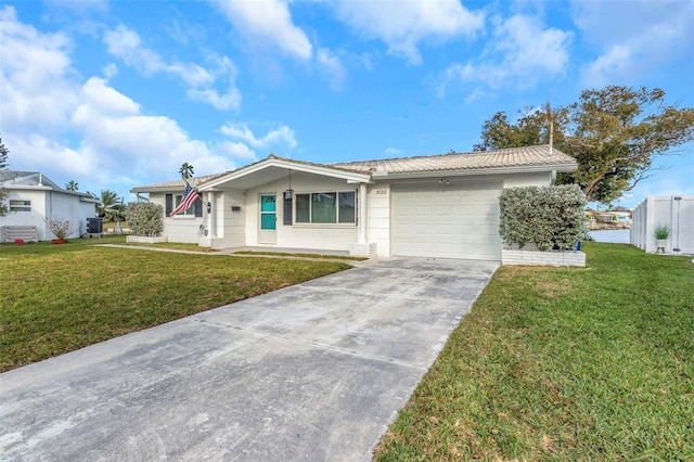 ranch-style home with central AC unit, a garage, and a front yard