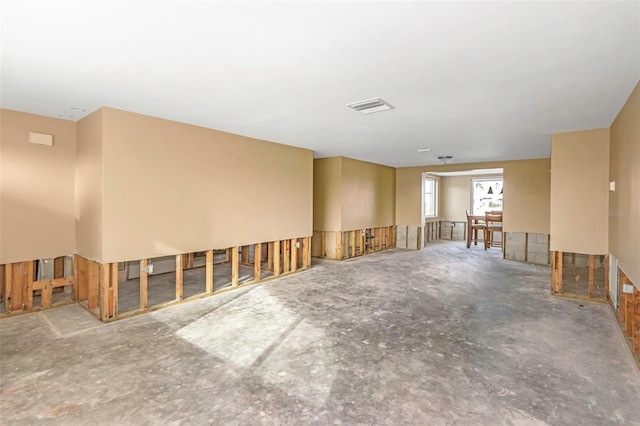 spare room featuring concrete flooring