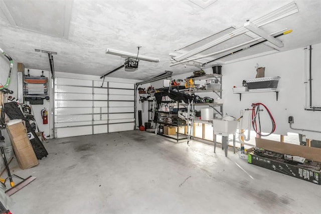 garage featuring a garage door opener