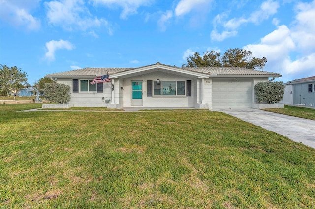 ranch-style home featuring a garage and a front yard