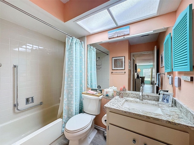 full bath featuring toilet, shower / bath combo, and vanity