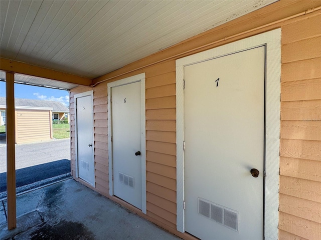 property entrance with visible vents