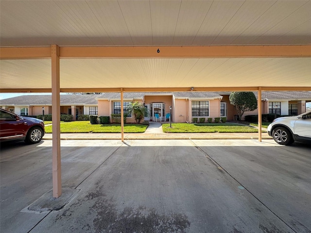 exterior space featuring covered parking