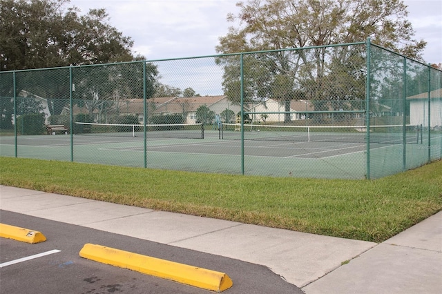 view of tennis court with fence