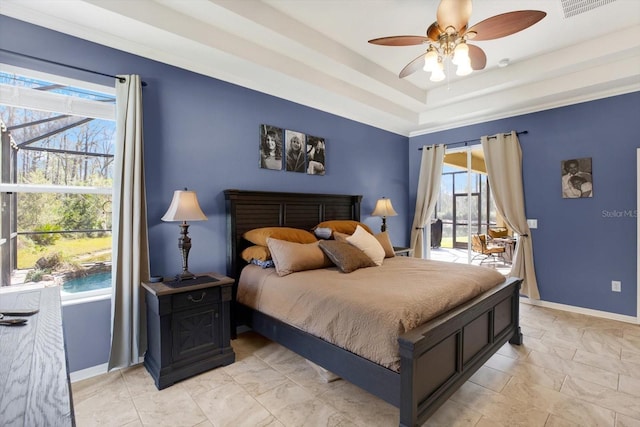 bedroom featuring access to outside, a raised ceiling, a ceiling fan, and baseboards