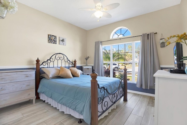 bedroom with ceiling fan and wood finish floors