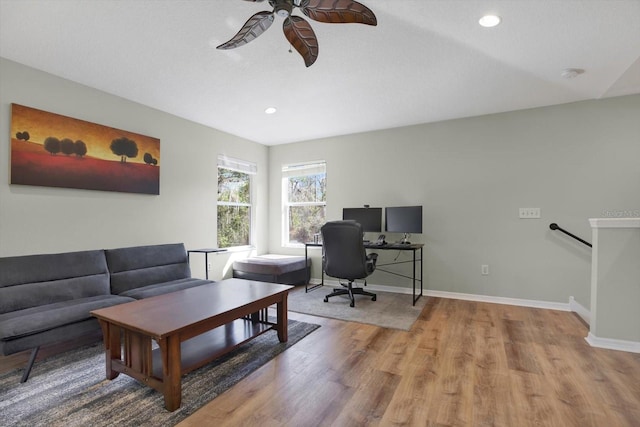 office space featuring recessed lighting, ceiling fan, baseboards, and wood finished floors