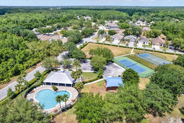 birds eye view of property featuring a residential view and a forest view